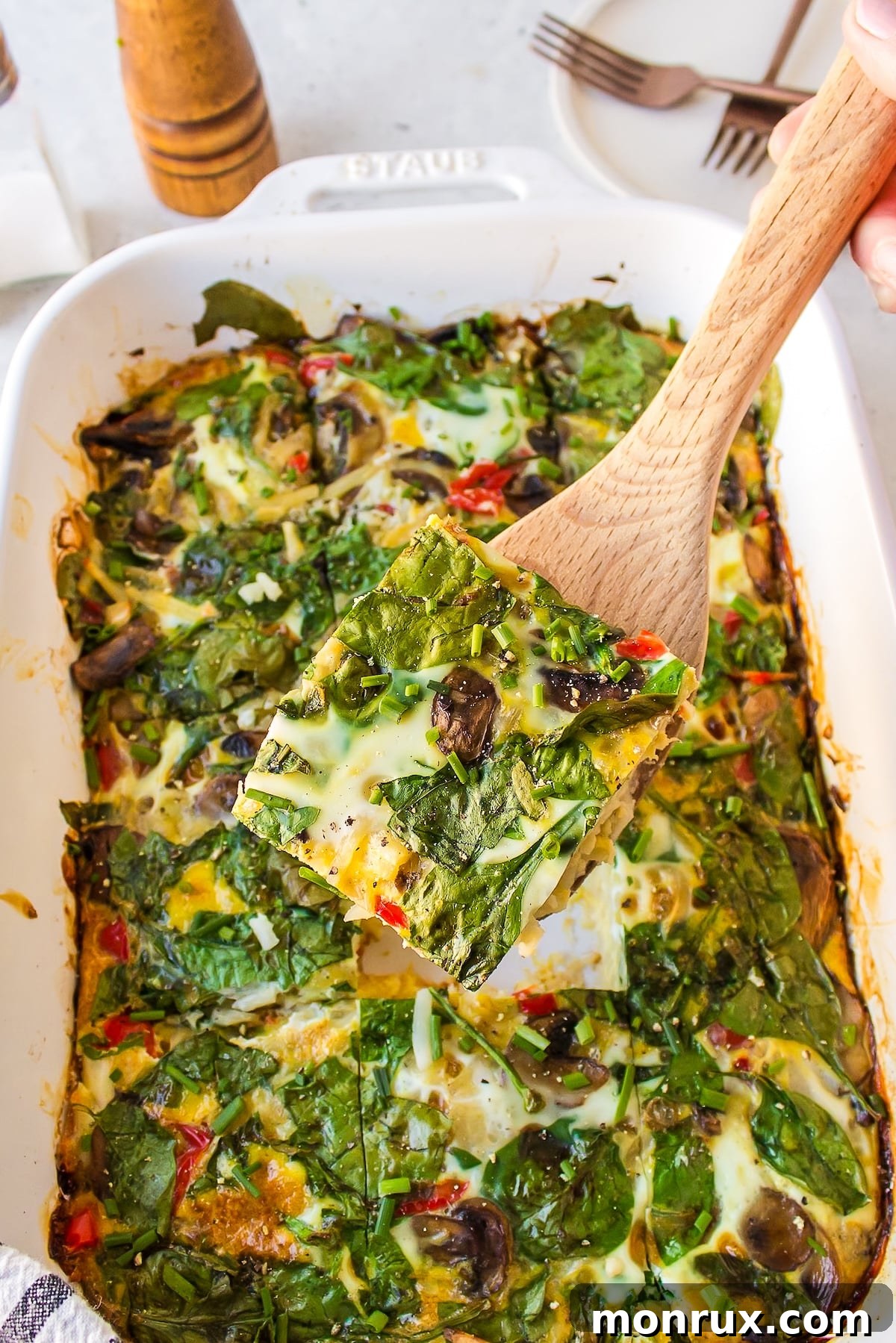 a piece of dairy-free breakfast casserole on a spatula.