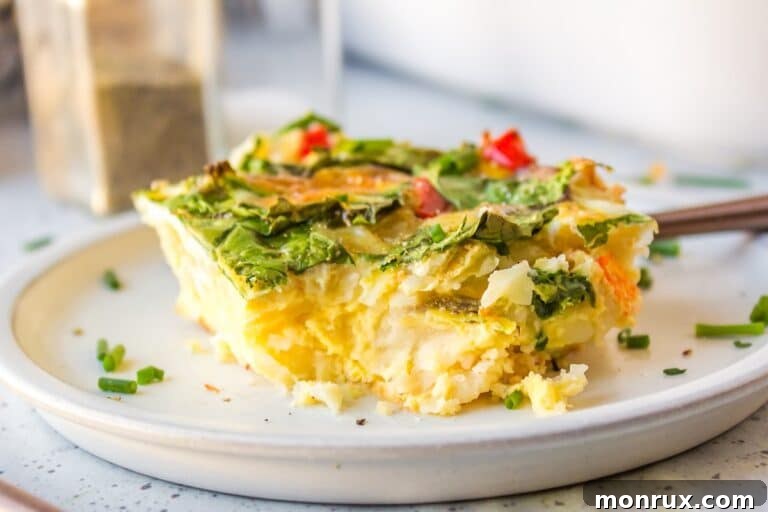 a slice of dairy-free breakfast casserole on white plate.