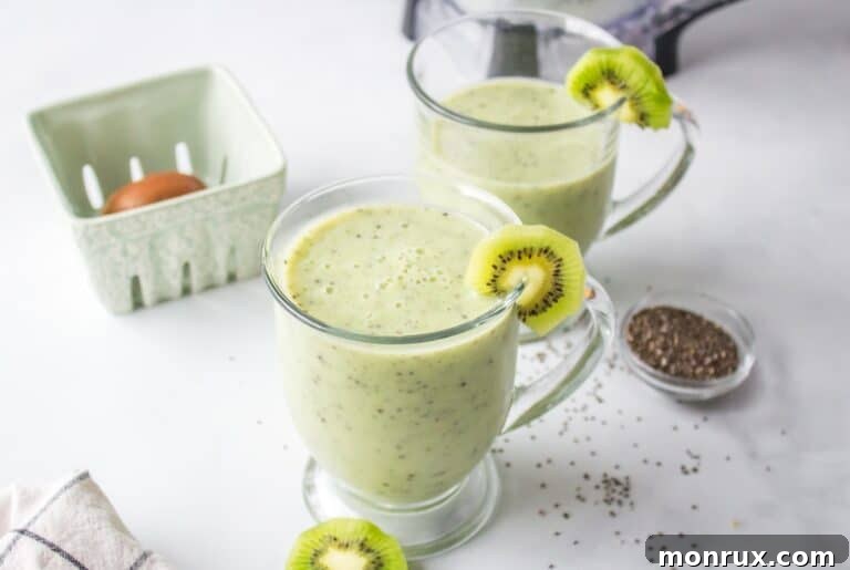 A glass of a kiwi smoothie with a straw.