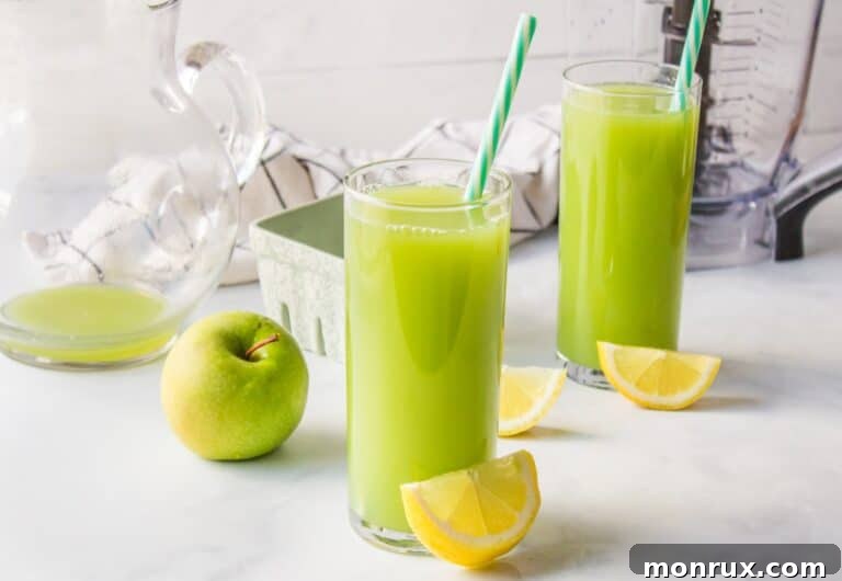 Cucumber Apple Juice with lemon wedge.