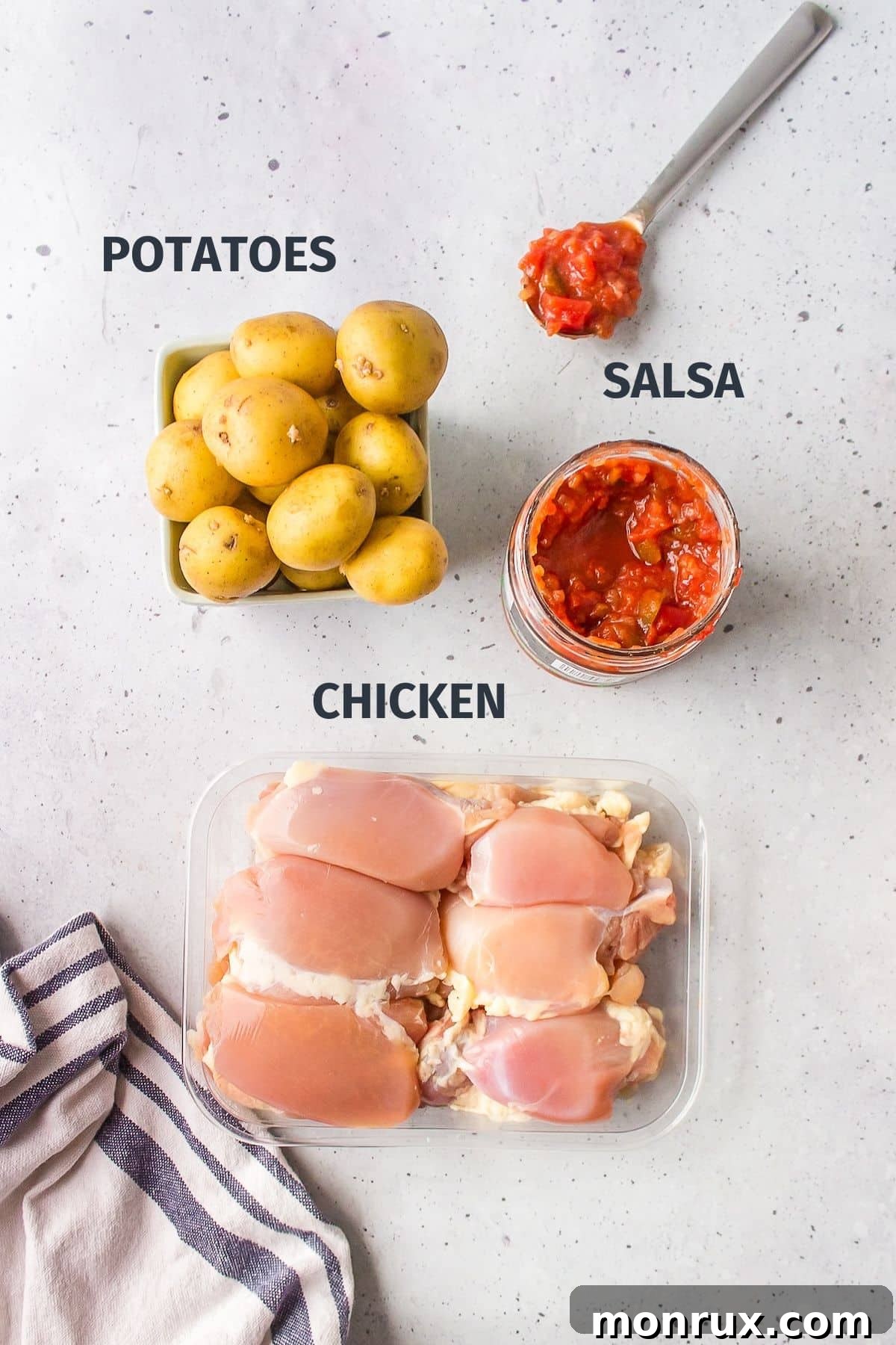 ingredients for making slow cooker chicken potatoes, including chicken thighs, small potatoes, and salsa.