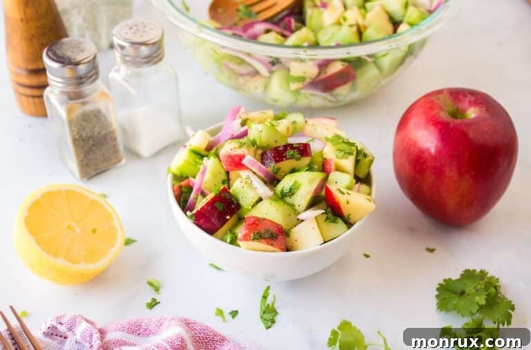 A crisp and refreshing Apple Cucumber Salad with a light vinaigrette.