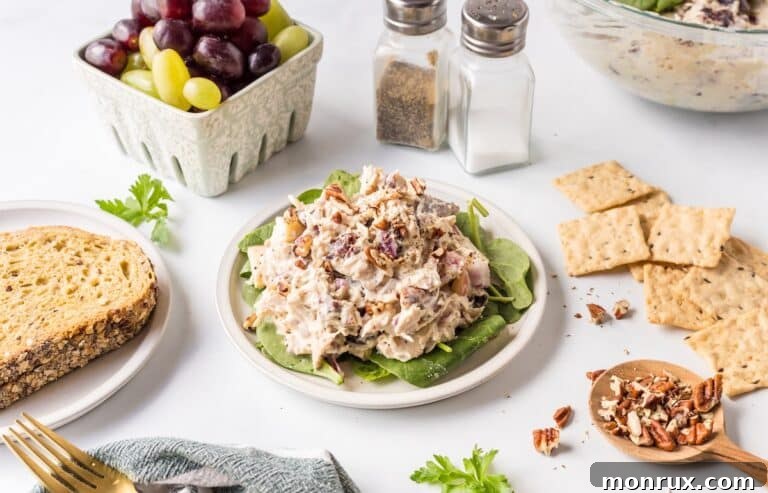 Apple Pecan Chicken Salad served with various healthy side dishes.