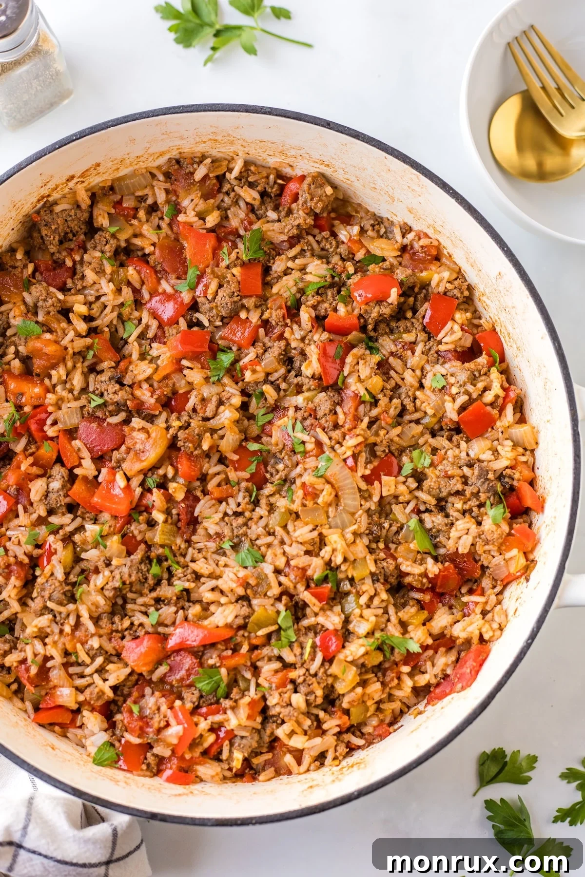A vibrant Unstuffed Pepper Skillet, freshly cooked and ready to serve, showcasing colorful bell peppers, ground beef, and rice.