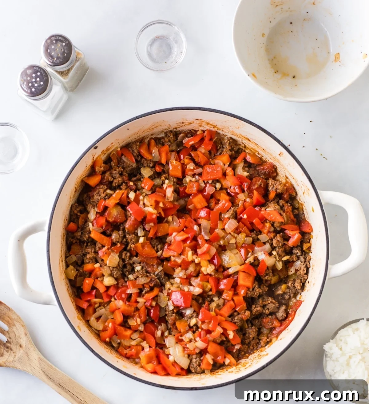 Third step of Unstuffed Pepper Skillet, showing cooked ground beef mixture combined with sautéed vegetables.