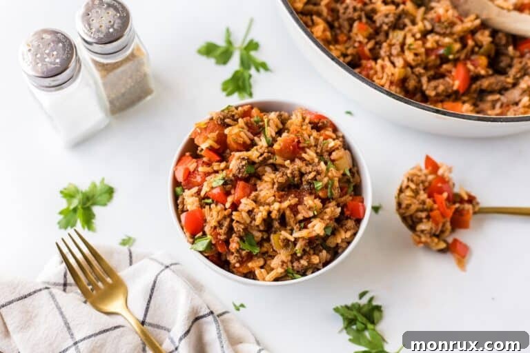 A large bowl of Unstuffed Pepper Skillet, garnished with fresh herbs, ready for a family meal.
