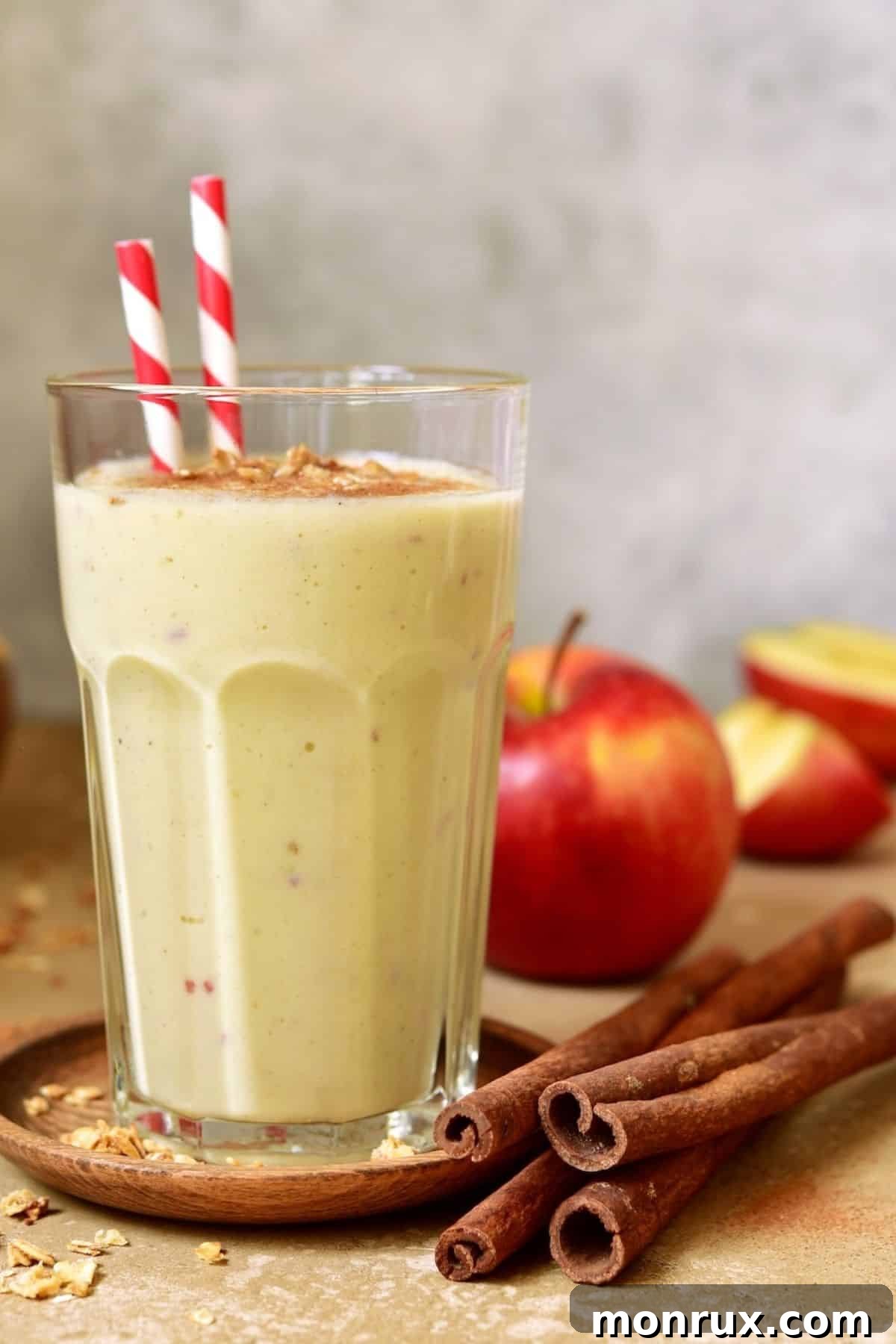 Cinnamon apple cider vinegar smoothie with straws, elegantly presented and ready to enjoy.