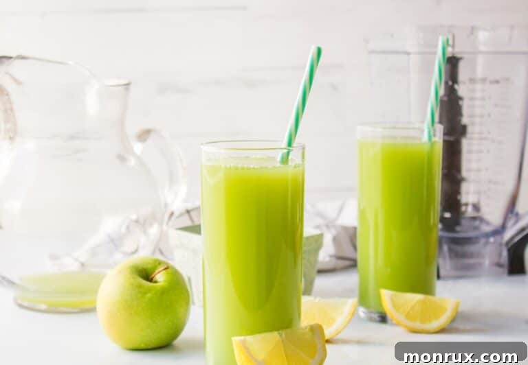 Apple ginger lemon juice served in two glasses, ready for enjoyment.