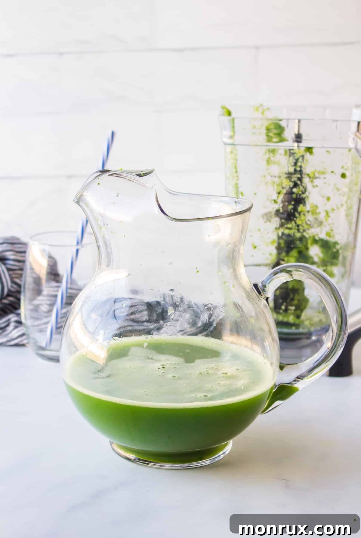 strained mean green juice in pitcher.